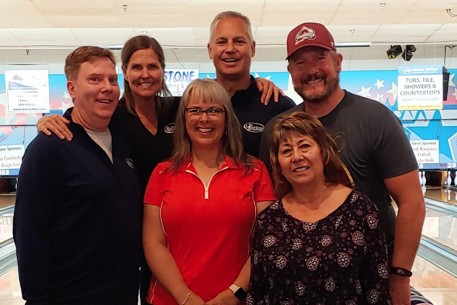 Meet Our Team - Group Portrait of a Select Group of Teammates from 1st American Insurance Agency in a Bowling Alley